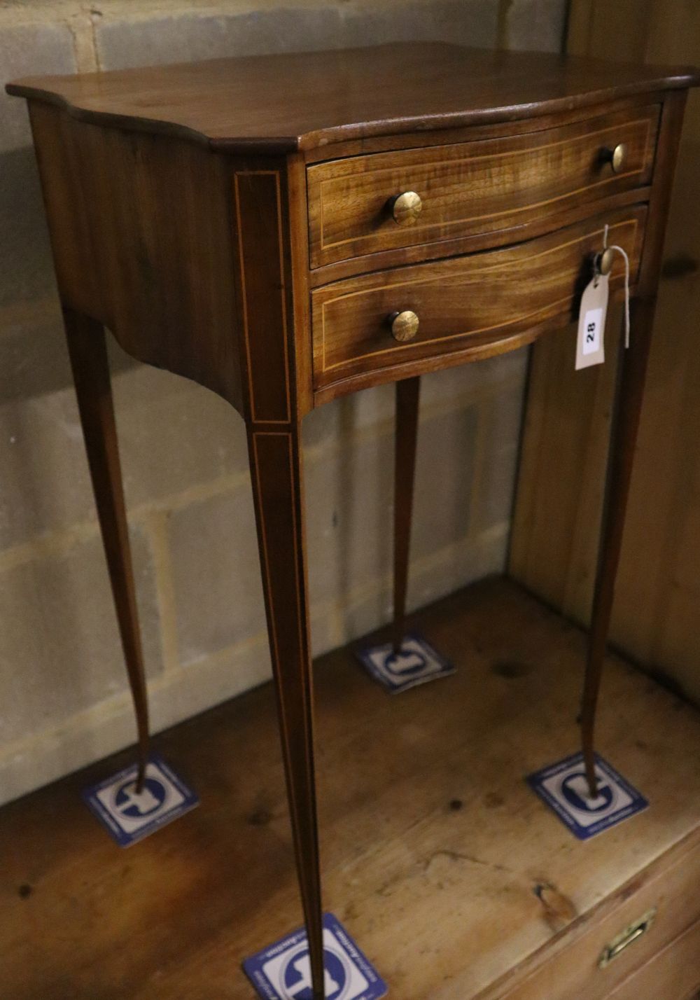 A small 19th century serpentine mahogany side table fitted two drawers, width 42cm depth 33cm height 70cm